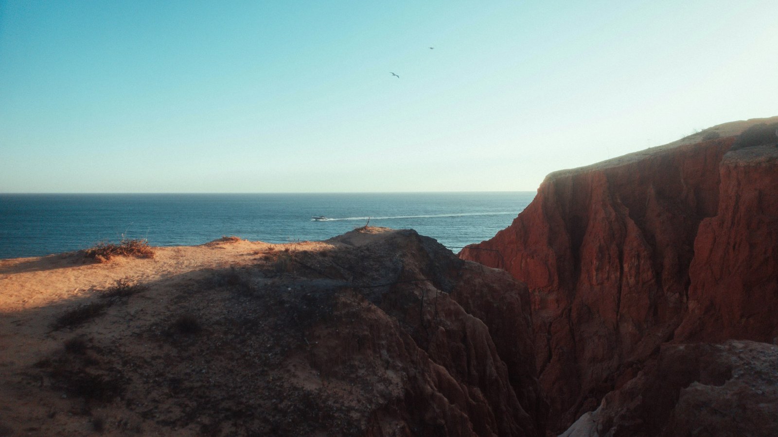 Ochre cliffs and the Atlantic along the Algarve coast